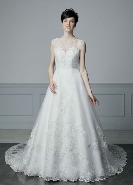 Elegante abito da sposa con corpetto trasparente per un look super sensuale fatto in raso e tulle con applicazioni in pizzo e pietre scintillanti