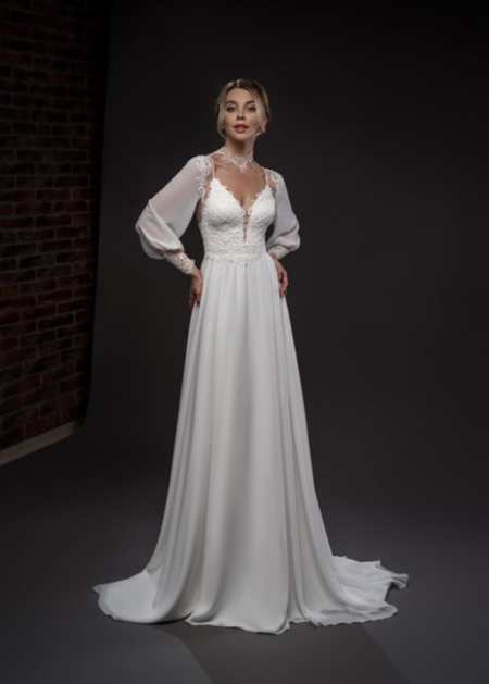 Eleganza da Red Carpet per questo abito da sposa romantico e sensuale, bustino stretto realizzato in pizzo
